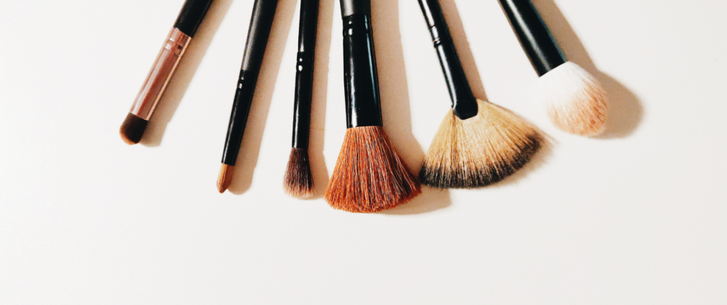 This image shows a group of makeup brushes