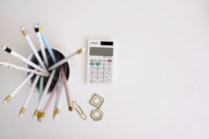 This image shows a calculator and pencils.