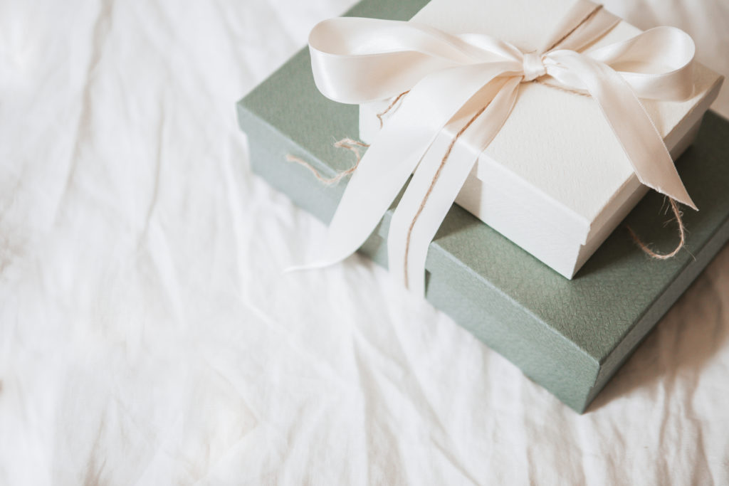 This image shows Christmas gifts wrapped in neutral colors.