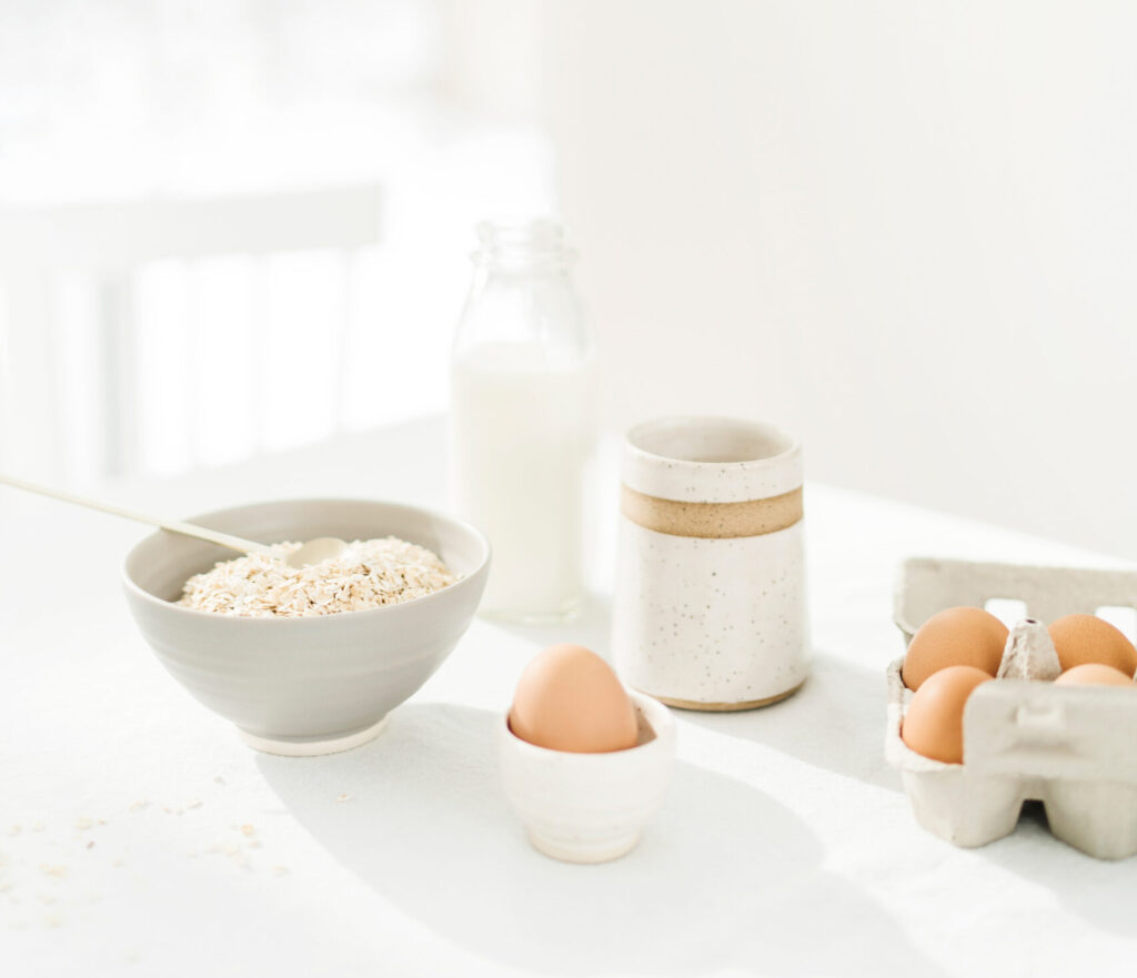 This image shows a carton of eggs on a dining table. In this episode, Jordan talks with Annika Duden about how to nourish your body with real food.