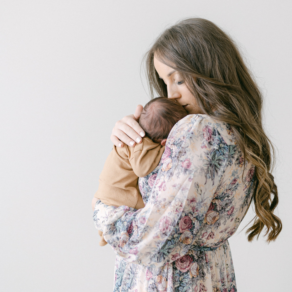 This image shows Jordan holding her son Noah. This episode talks about the best tips for postpartum.