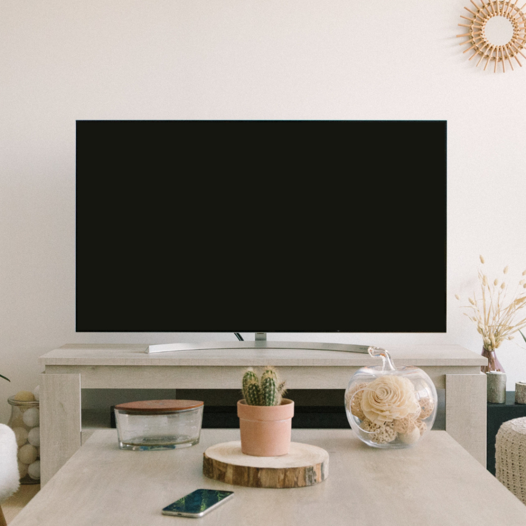This image shows a TV in the middle of a living room. In this episode, Jordan talks about how to manage screen time for your kids.