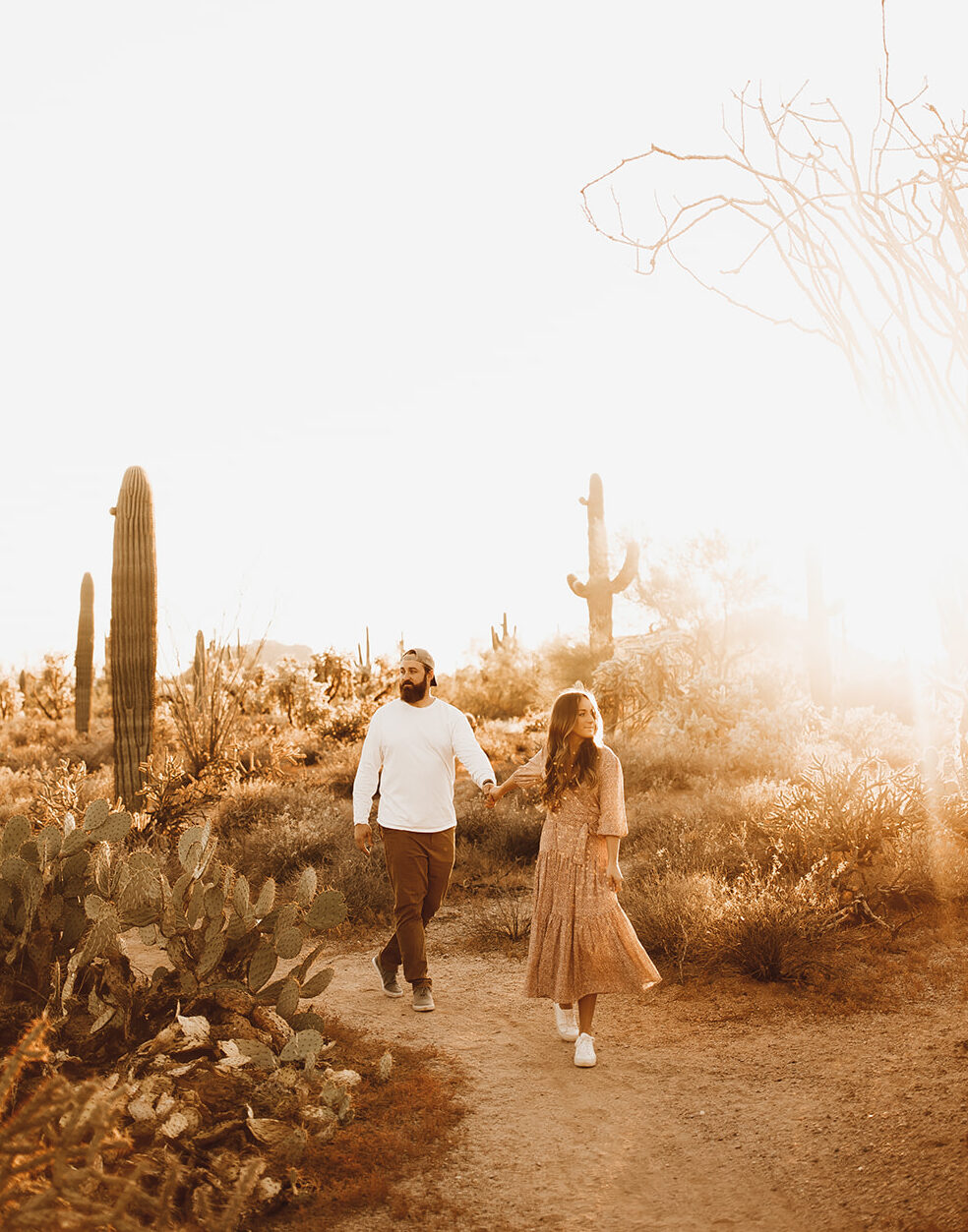 This image shows Jordan and her husband Matt holding hands while walking through the desert.