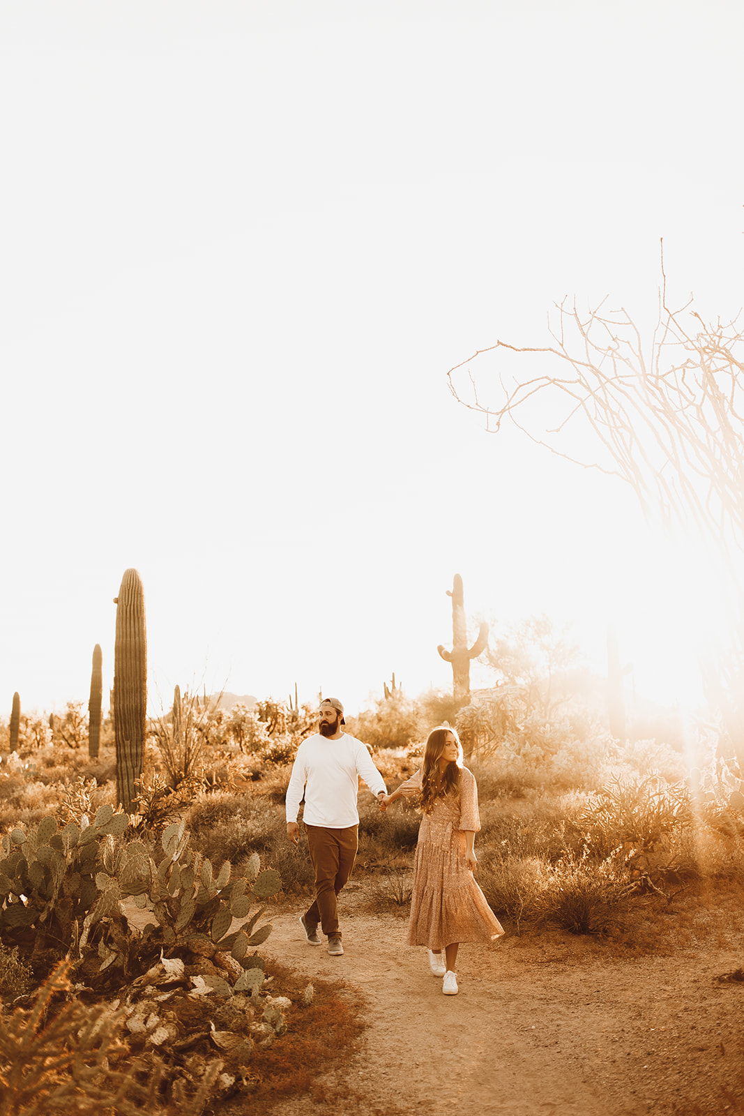 This image shows Jordan and her husband Matt holding hands while walking through the desert.
