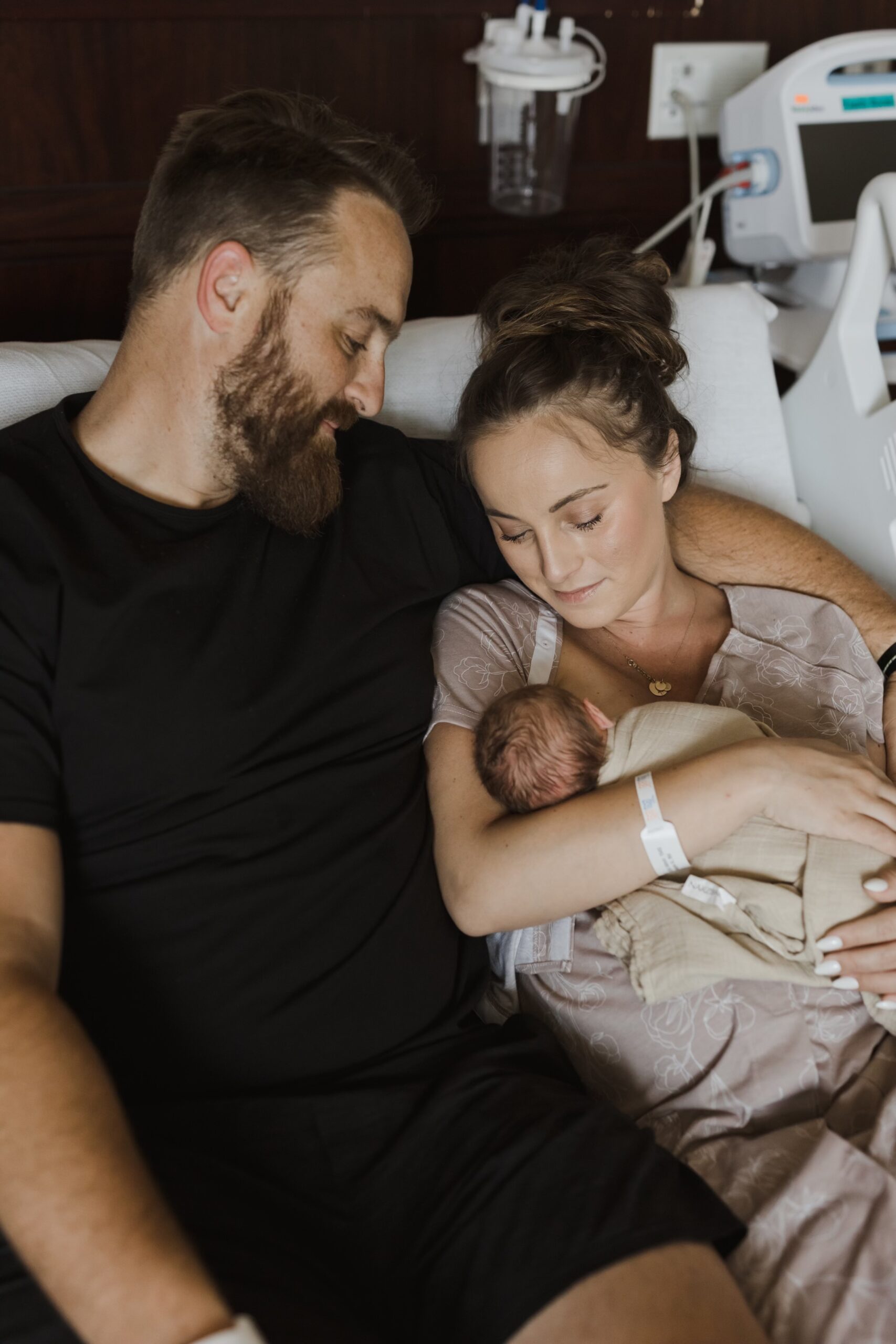 This image shows Jordan in the hospital with her husband, holding their newborn son, Shepherd.