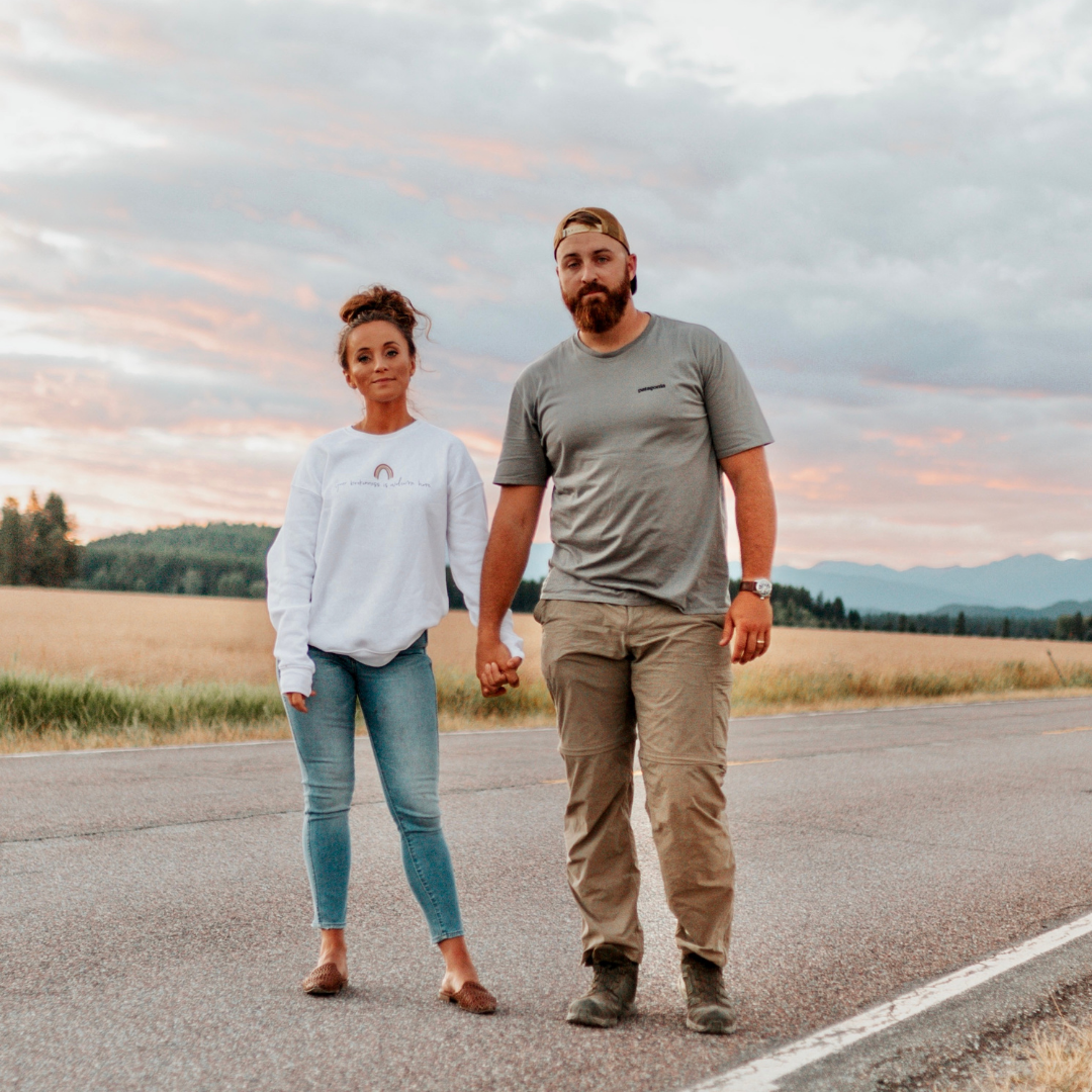 This image shows Jordan and her husband Matt standing in the middle of a road, holding hands. This episode talks about the hardest lesson Jordan learned on her fertility journey.