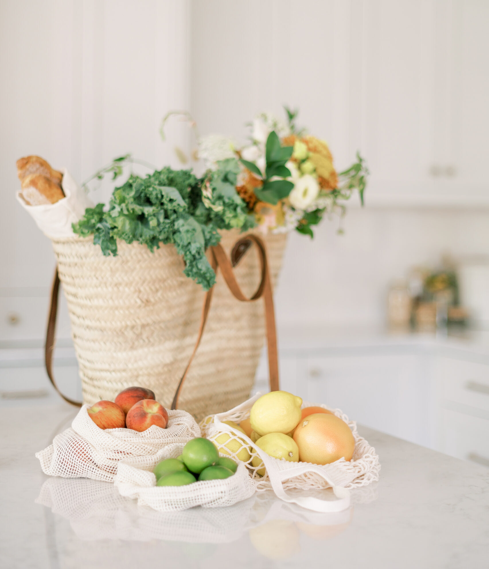 This image shows a bag of groceries with fresh food and vegetables. This episode is about nutrition principles and how to source local foods.