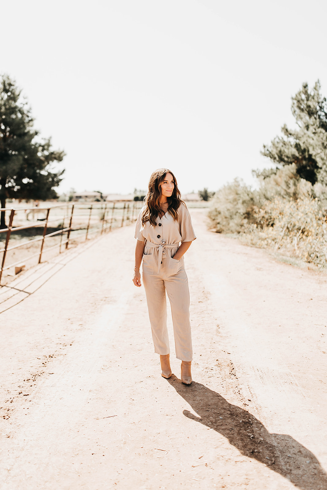 This image shows Jordan standing alone in the middle of a road, looking off to the right.